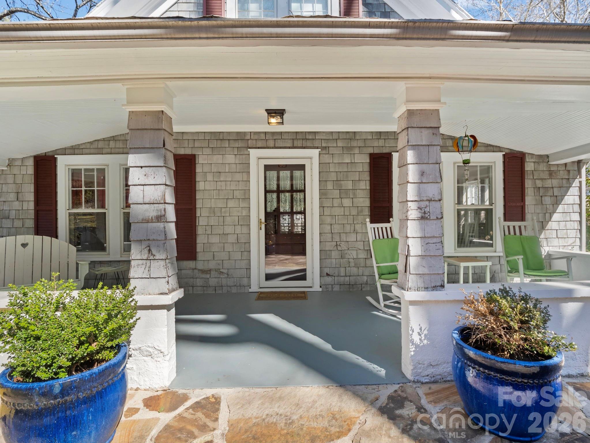 439 Lockhart Road Tryon, NC 28782 - Photo 34 of 43 a front view of a house with outdoor seating