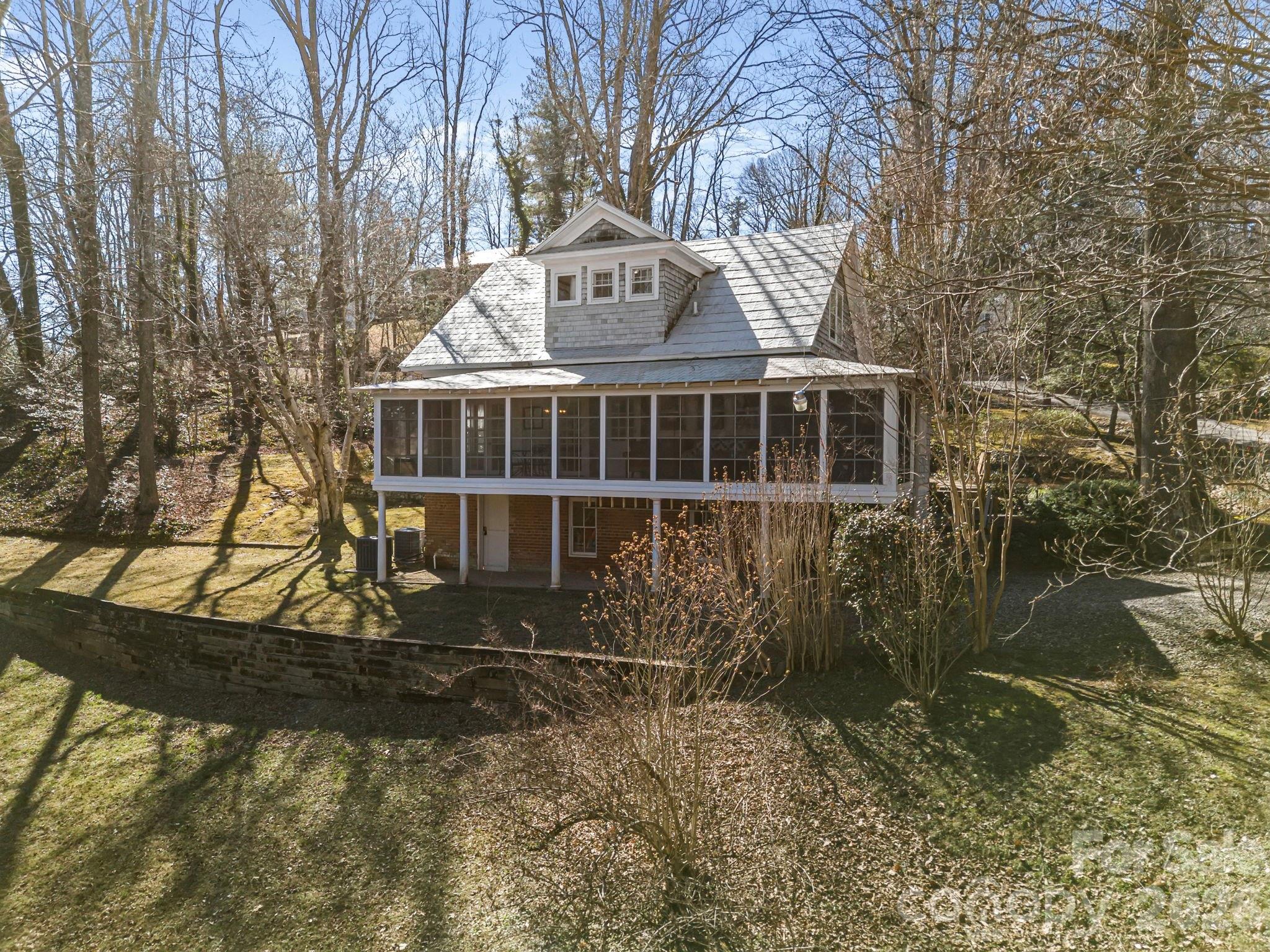 439 Lockhart Road Tryon, NC 28782 - Photo 4 of 43 a view of a house with a yard