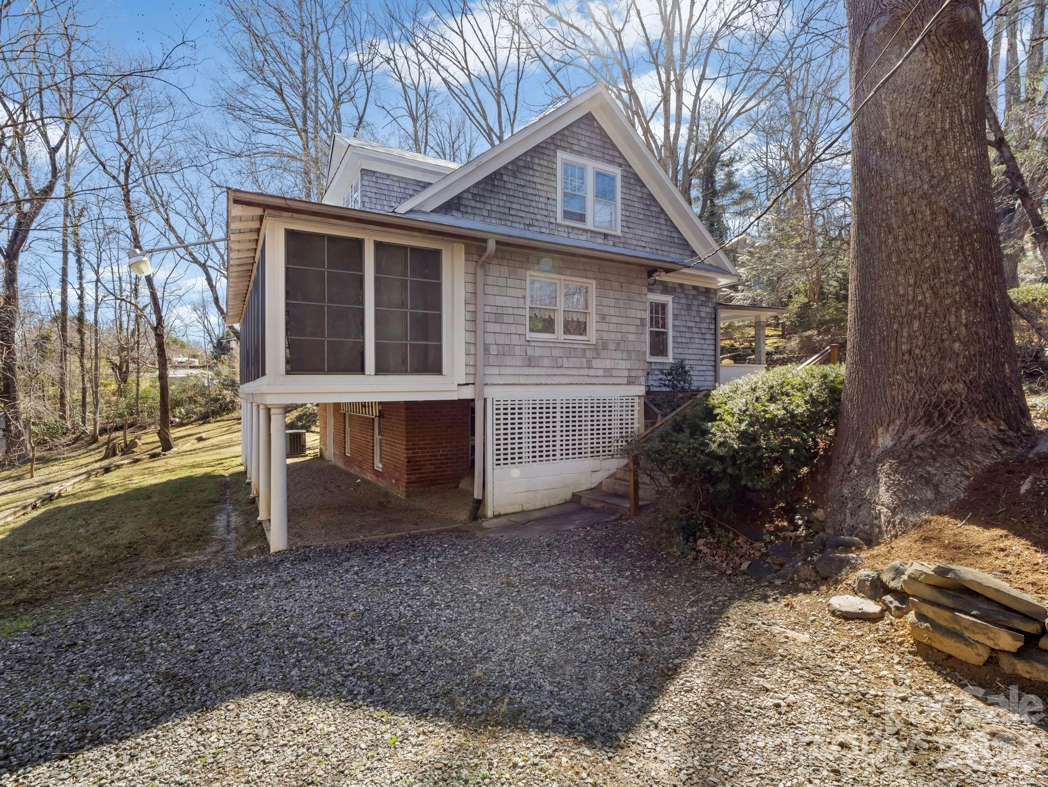 439 Lockhart Road Tryon, NC 28782 - Photo 5 of 43 a view of a house with backyard