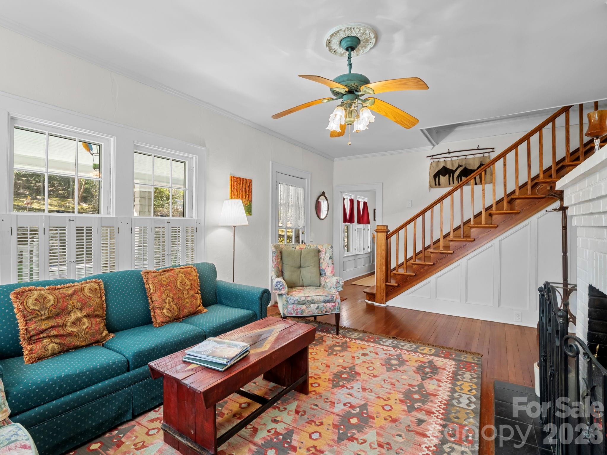 439 Lockhart Road Tryon, NC 28782 - Photo 7 of 43 a living room with furniture and a chandelier