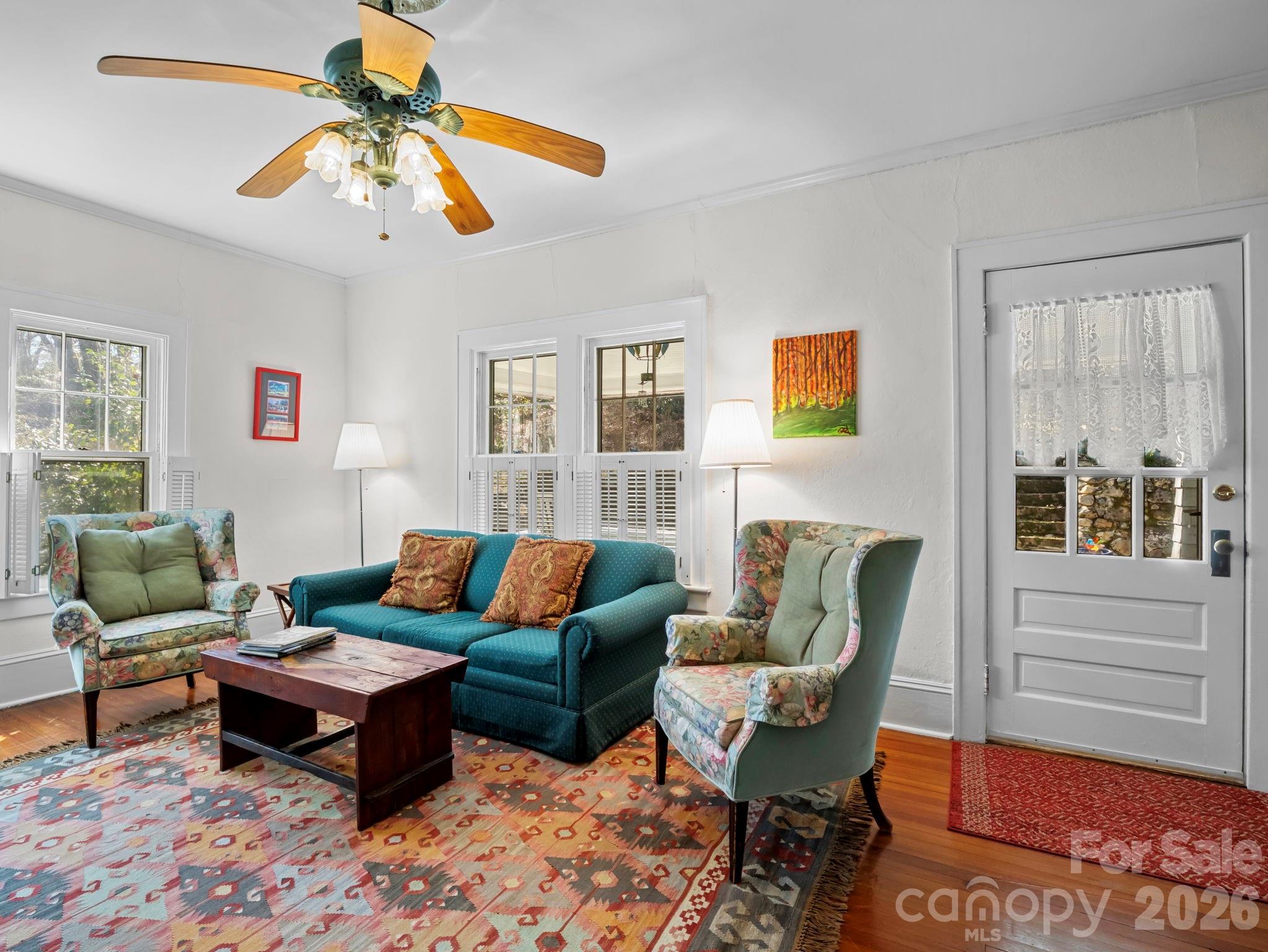 439 Lockhart Road Tryon, NC 28782 - Photo 8 of 43 a living room with furniture a rug and a window