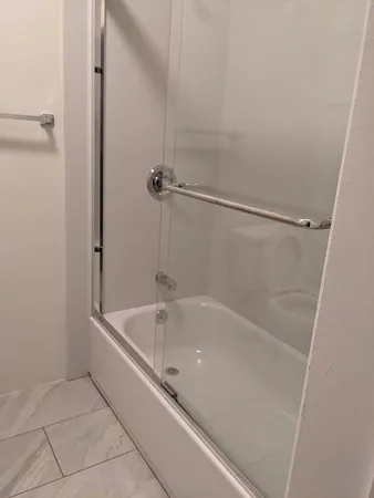 a close view of a bathtub in bathroom