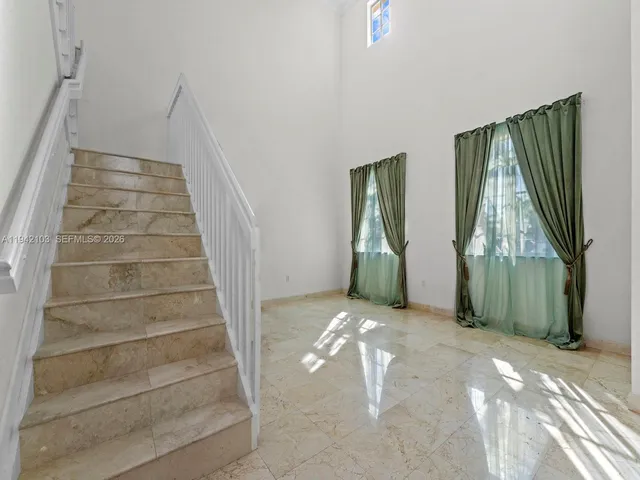 a view of an entryway with staircase