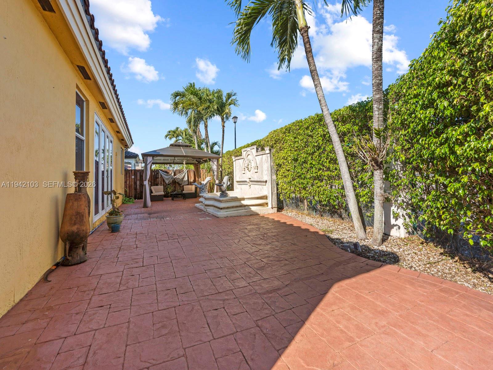 16421 Southwest 64th Terrace Miami, FL 33193 - Photo 37 of 45 a view of a pathway with a yard