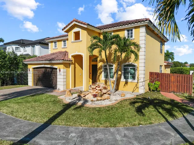 an aerial view of a house with swimming pool