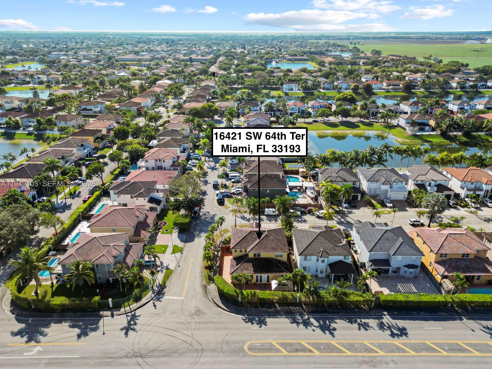 16421 Southwest 64th Terrace Miami, FL 33193 - Photo 44 of 45 an aerial view of residential houses with outdoor space and swimming pool