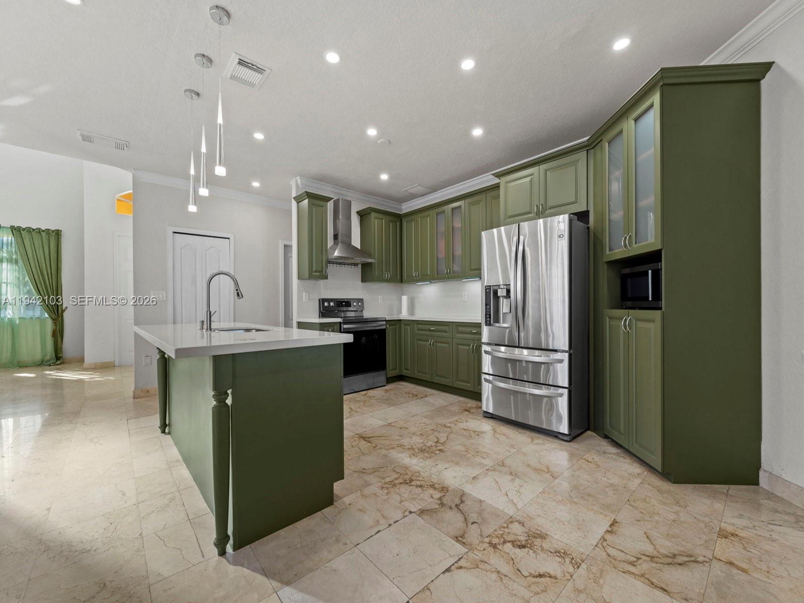 16421 Southwest 64th Terrace Miami, FL 33193 - Photo 7 of 45 a kitchen with refrigerator and cabinets