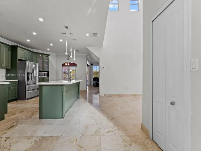 a kitchen with lots of counter top space and appliances