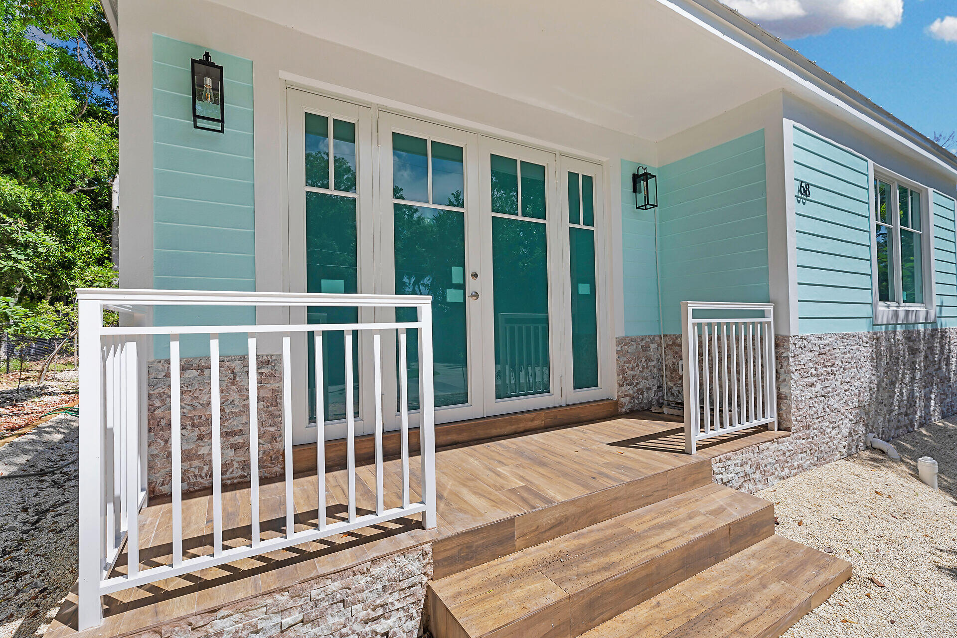 68 Coral Way Key Largo, FL 33037 - Photo 1 of 31 a view of a balcony with wooden floor