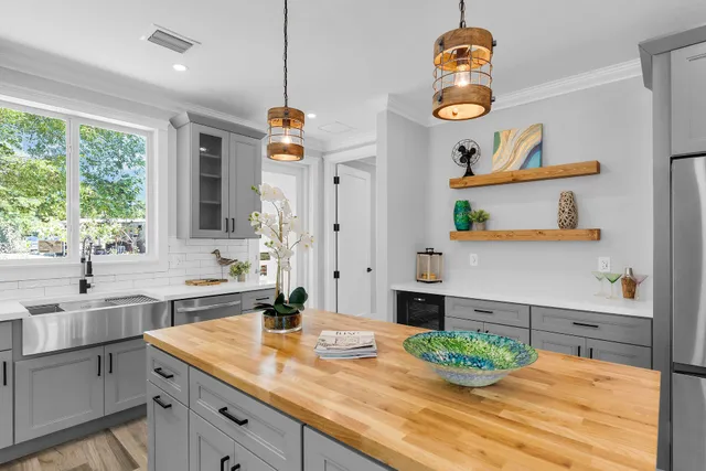 a kitchen with a sink and cabinets