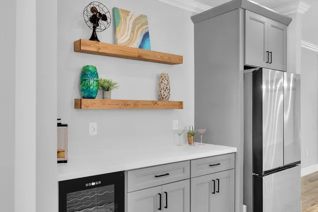 a kitchen with sink stove and cabinets