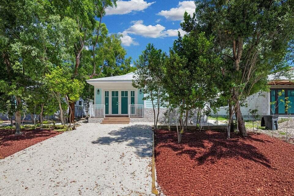 68 Coral Way Key Largo, FL 33037 - Photo 2 of 31 a view of a house with backyard and sitting area