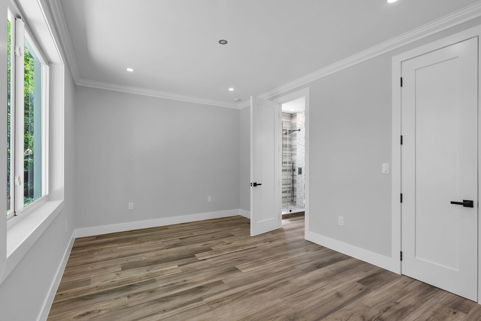 68 Coral Way Key Largo, FL 33037 - Photo 25 of 31 a view of an empty room with wooden floor and a window