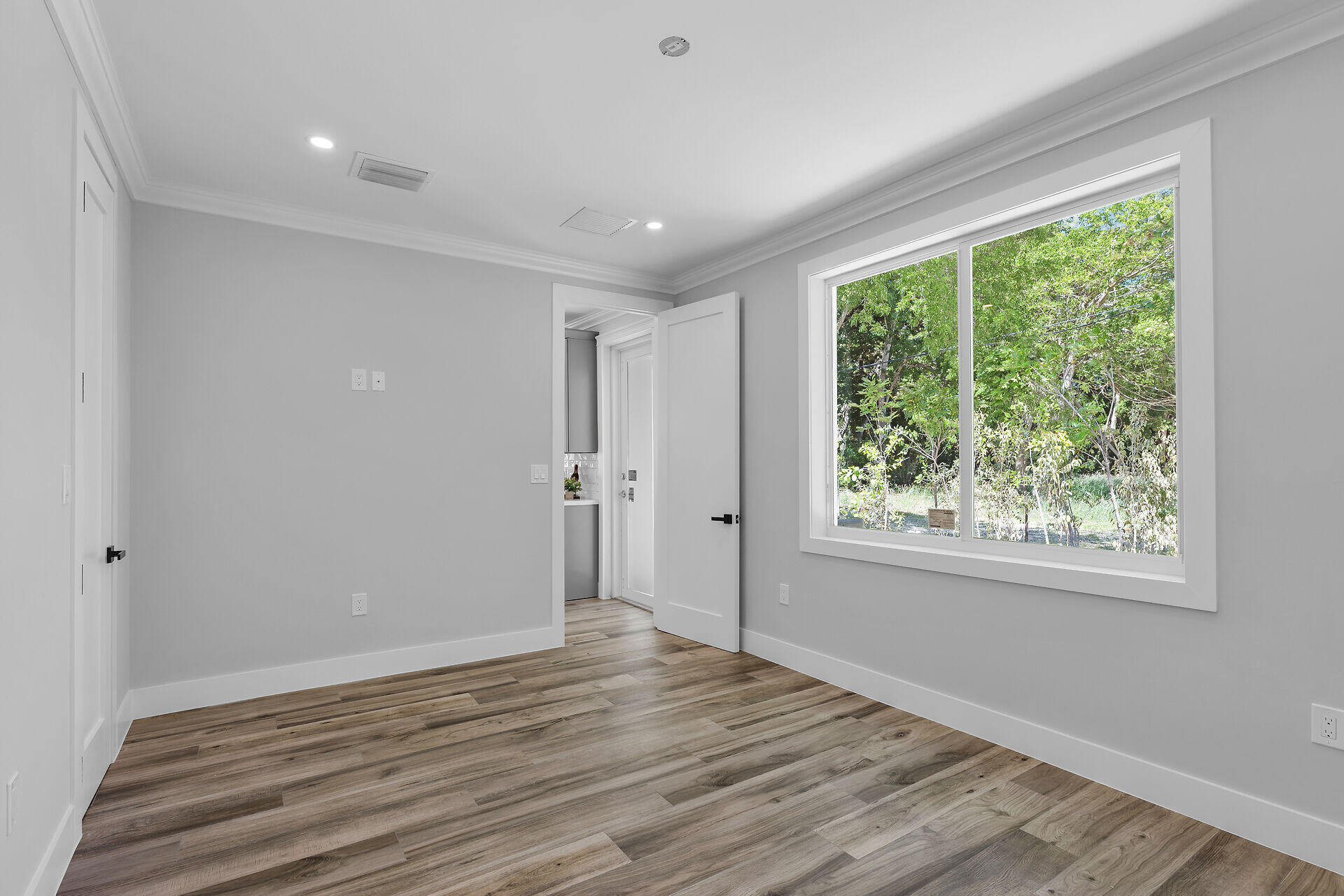 68 Coral Way Key Largo, FL 33037 - Photo 26 of 31 a view of empty room with wooden floor and fan
