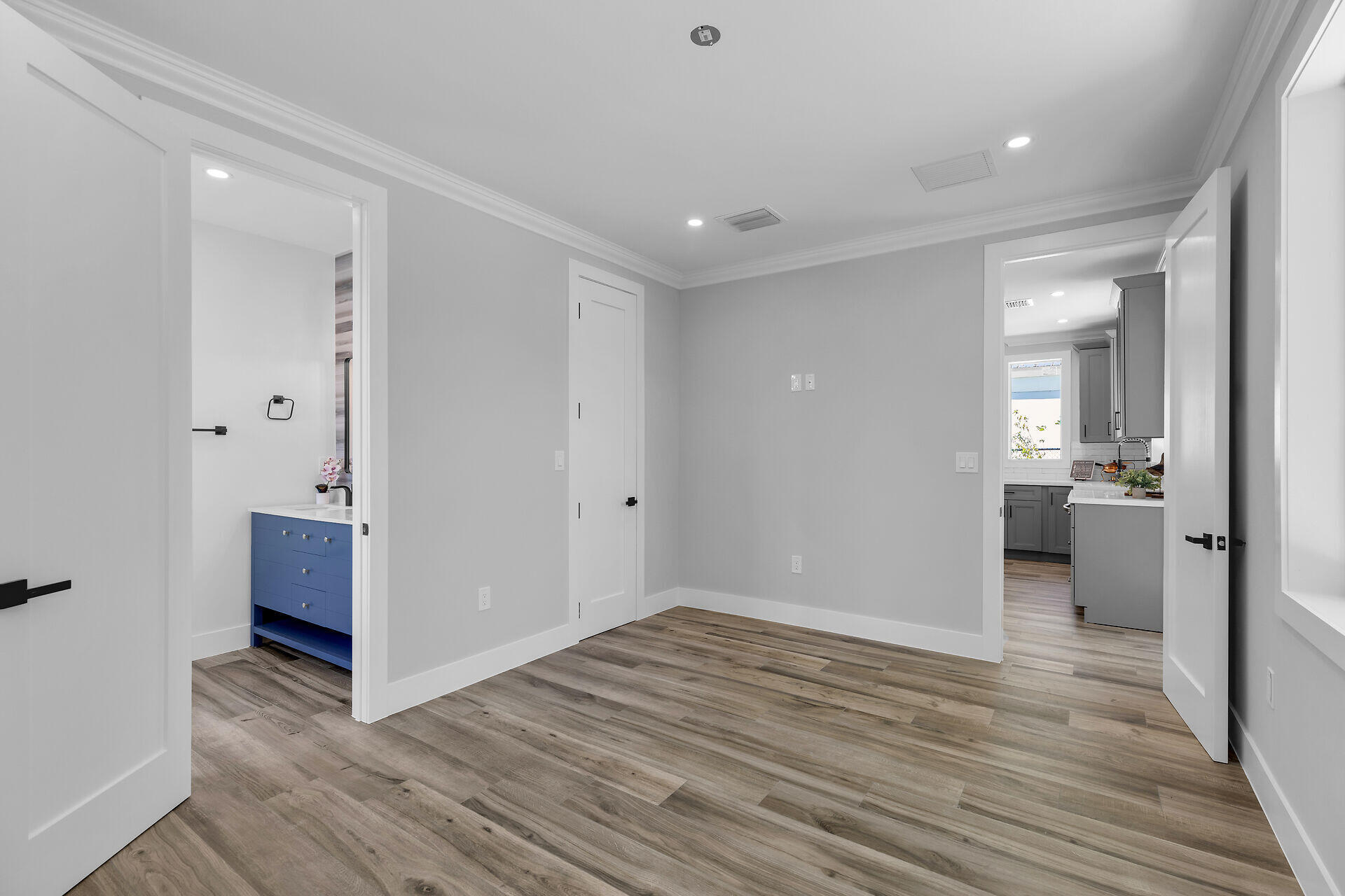 68 Coral Way Key Largo, FL 33037 - Photo 27 of 31 a view of a room with wooden floor and a bathroom
