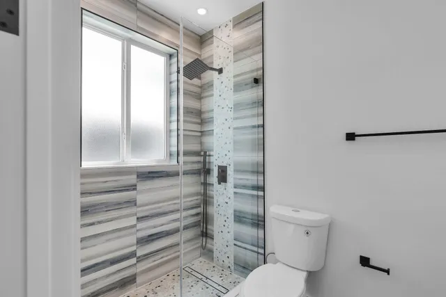 a view of a hallway with washer and dryer