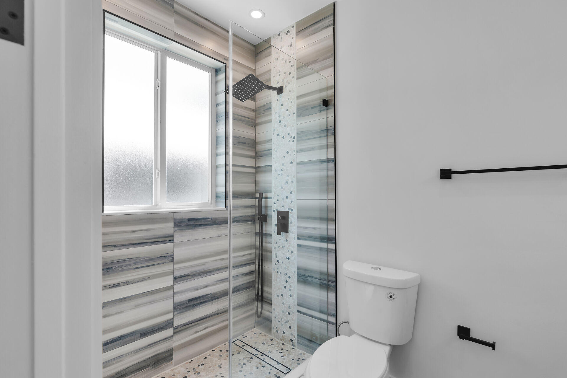 68 Coral Way Key Largo, FL 33037 - Photo 29 of 31 a bathroom with a shower and a toilet