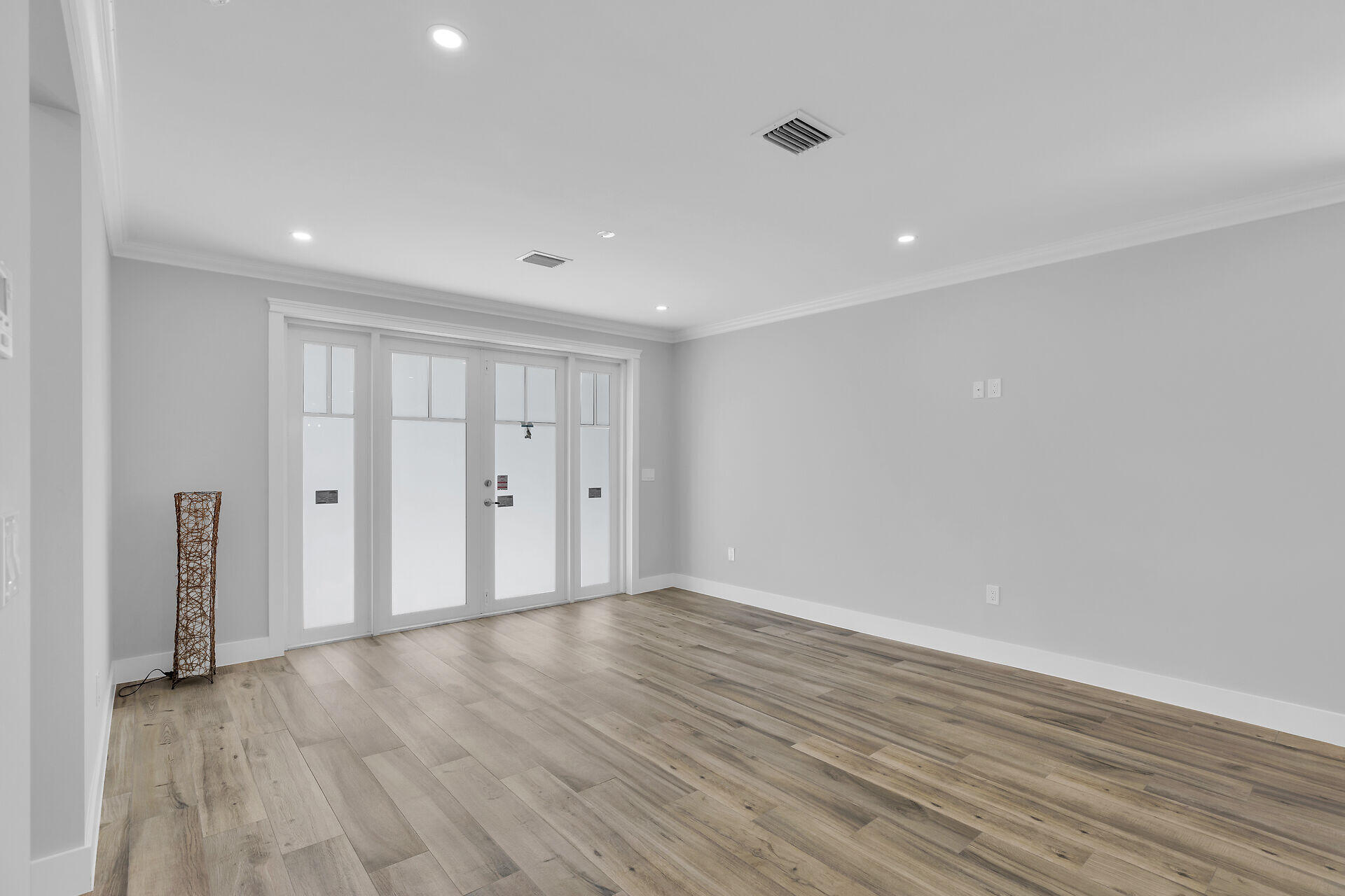 68 Coral Way Key Largo, FL 33037 - Photo 5 of 31 a view of an empty room with wooden floor