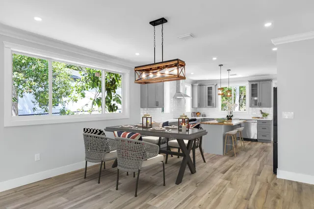 a view of a dining room with furniture window and wooden floor