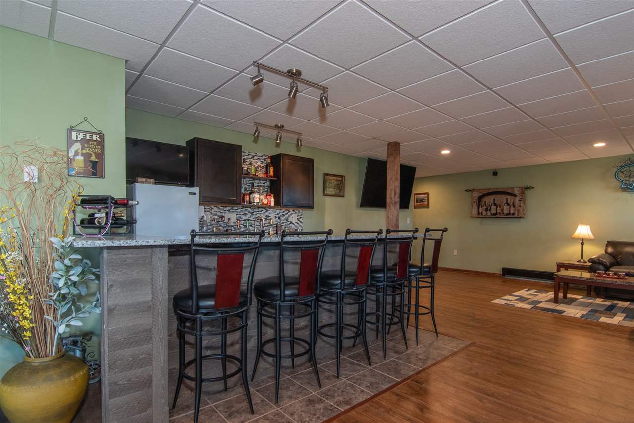 10024 Wheeler Road Durand, IL 61024 - Photo 22 of 25 a view of a dining room with furniture and wooden floor