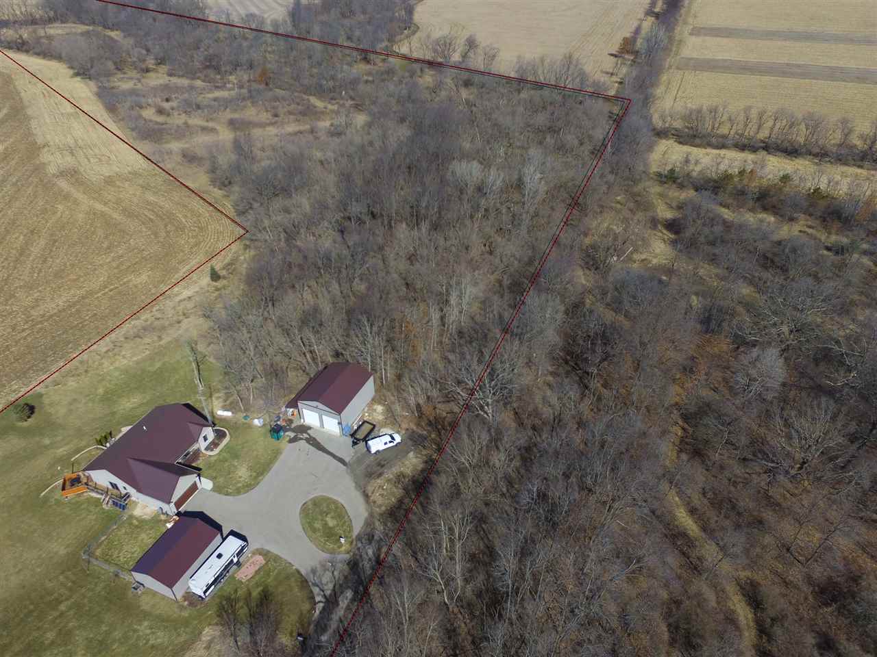 10024 Wheeler Road Durand, IL 61024 - Photo 4 of 25 a aerial view of a house with a yard and large tree