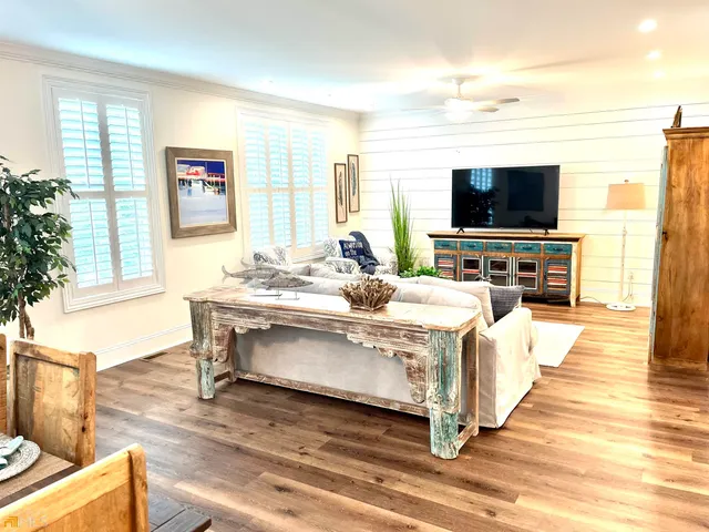 a living room with a couch and a flat screen tv