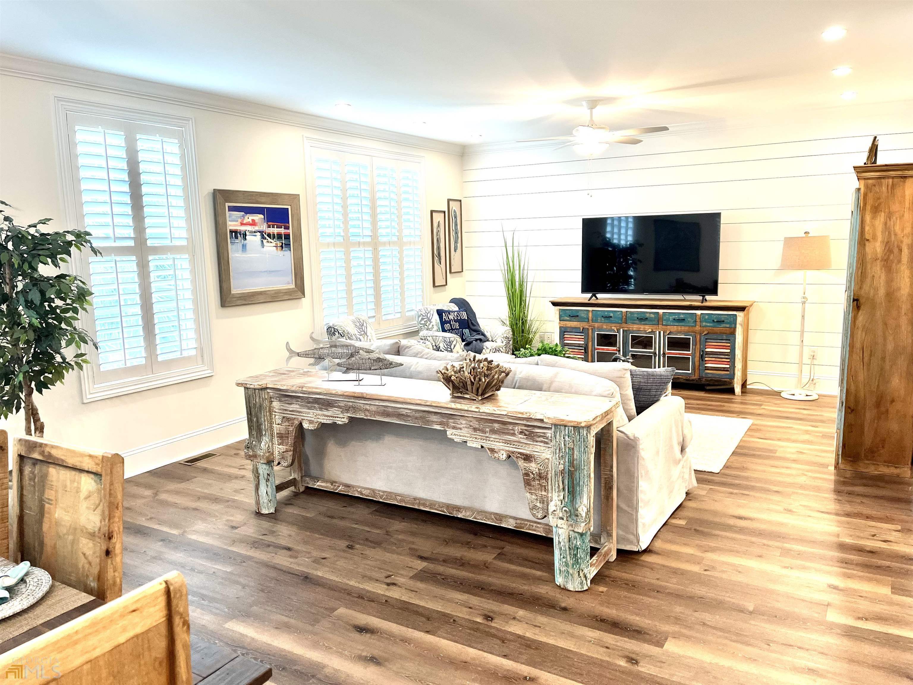 1548 Ocean Boulevard St. Simons, GA 31522 - Photo 12 of 64 a living room with furniture and a flat screen tv