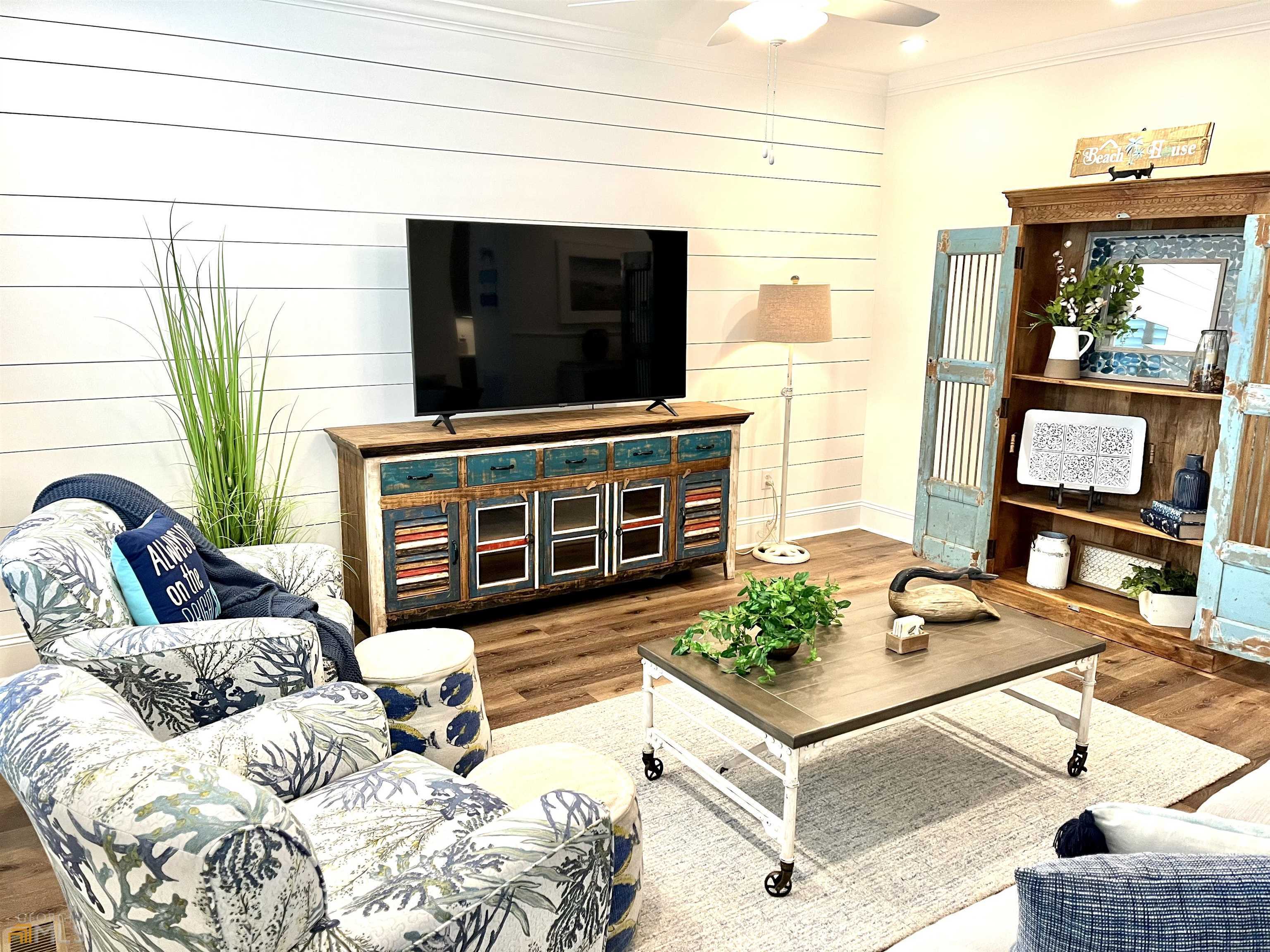 1548 Ocean Boulevard St. Simons, GA 31522 - Photo 15 of 64 a living room with furniture and a flat screen tv