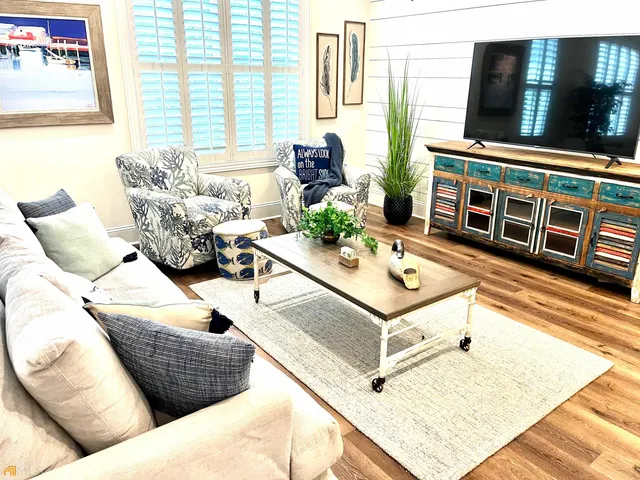 a living room with furniture and a table