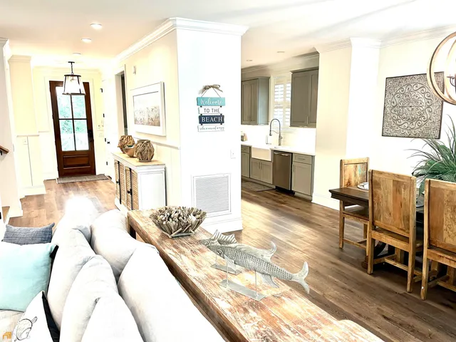 a living room with furniture and a large mirror