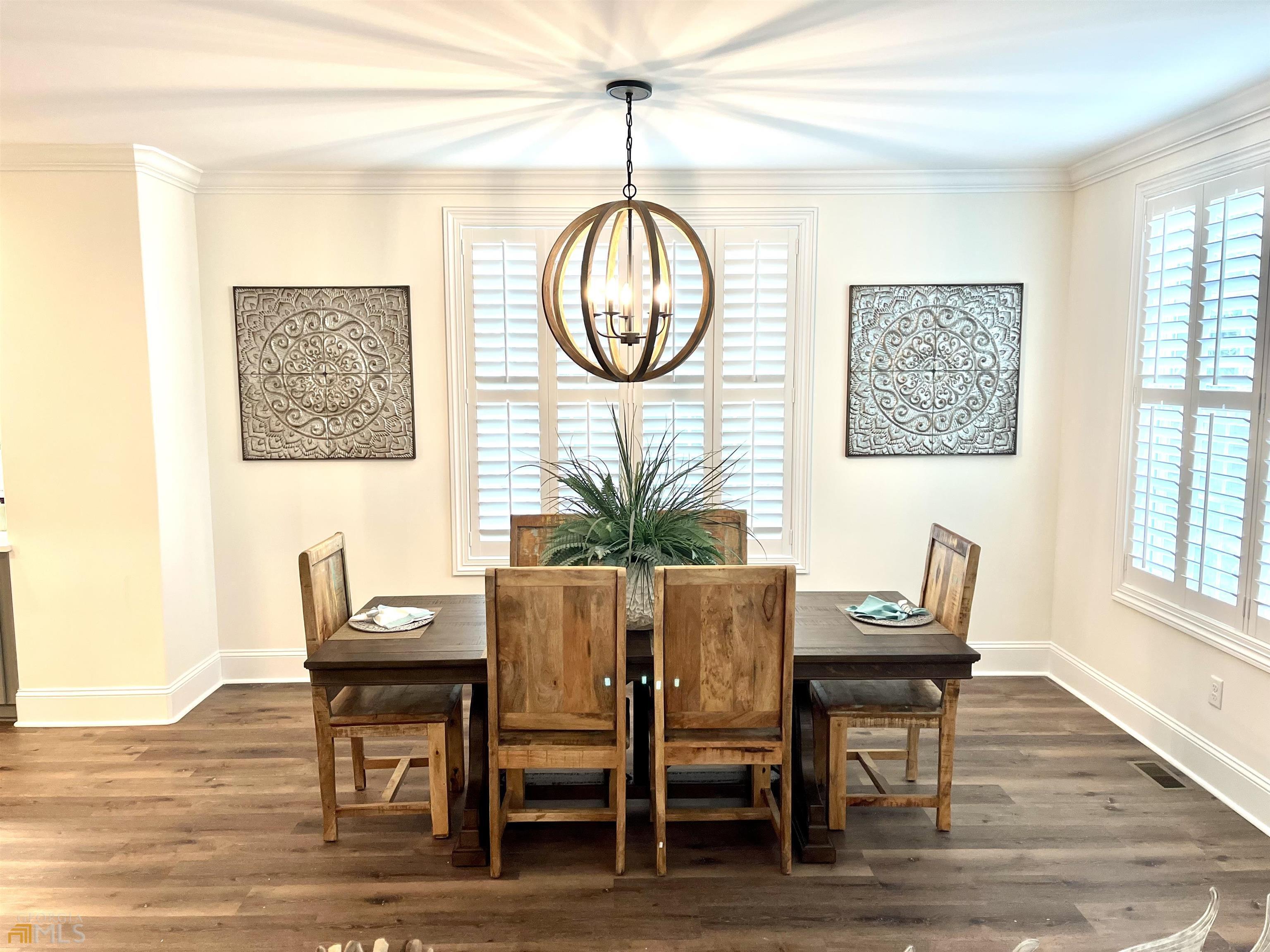 1548 Ocean Boulevard St. Simons, GA 31522 - Photo 21 of 64 a view of a dining room with furniture and wooden floor