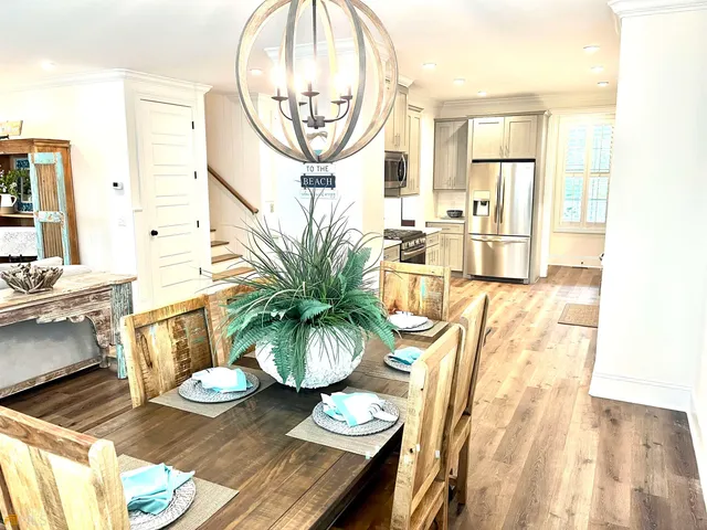 a kitchen with a sink cabinets and a refrigerator