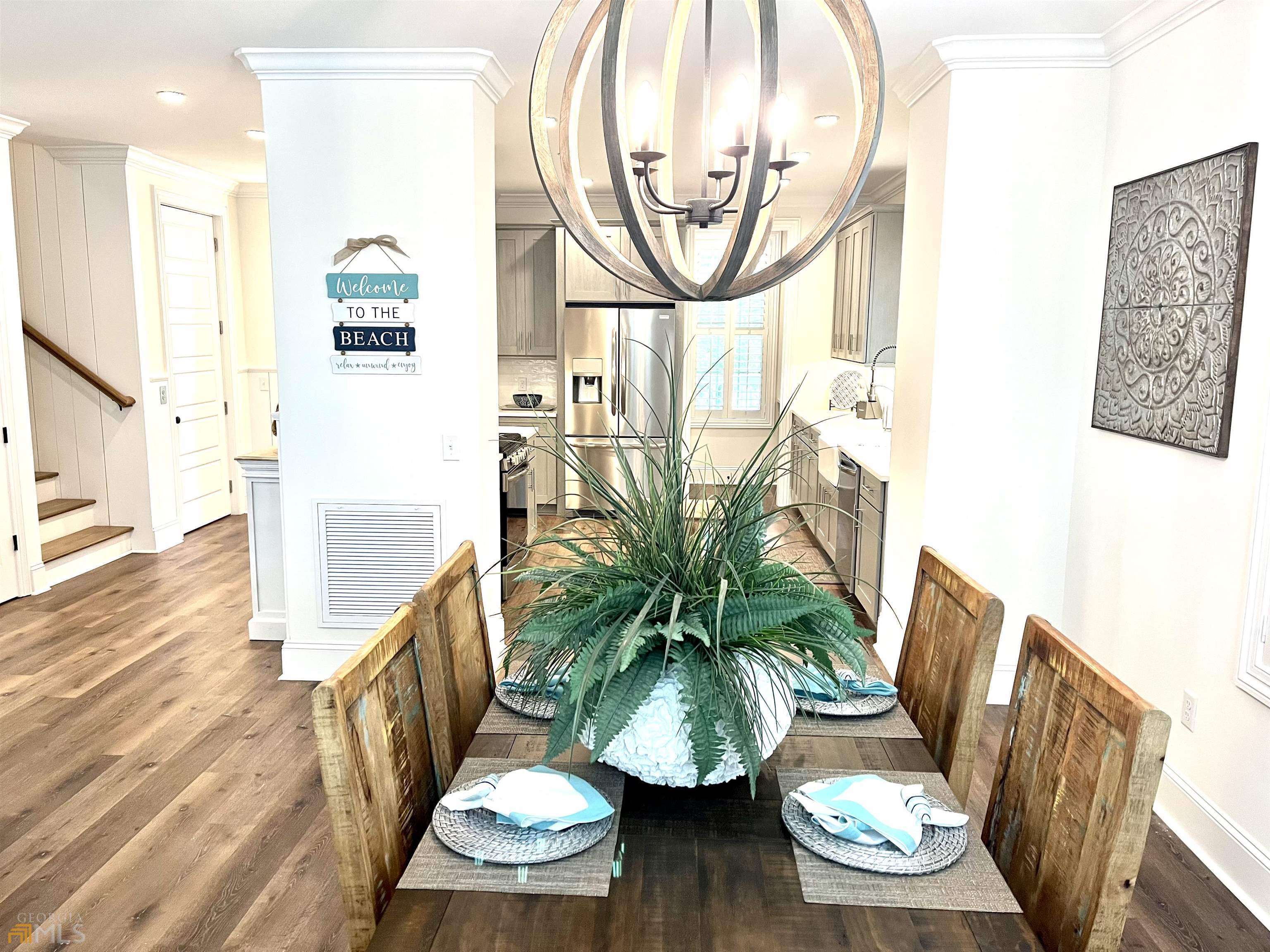 1548 Ocean Boulevard St. Simons, GA 31522 - Photo 23 of 64 a view of a living room with furniture and wooden floor