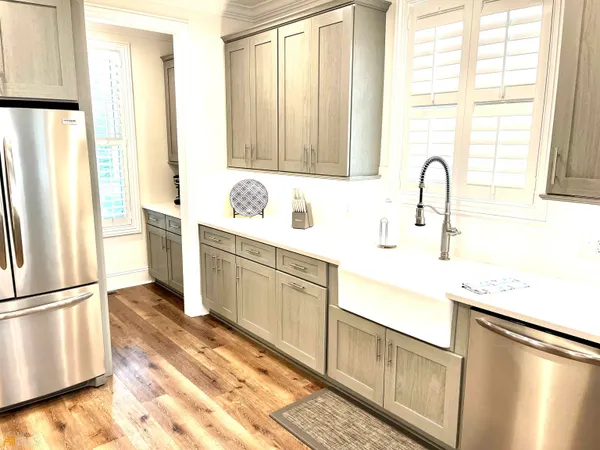 a kitchen with a sink and cabinets