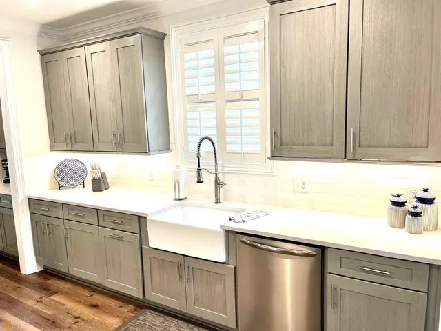 a bedroom with a bed and a night stand