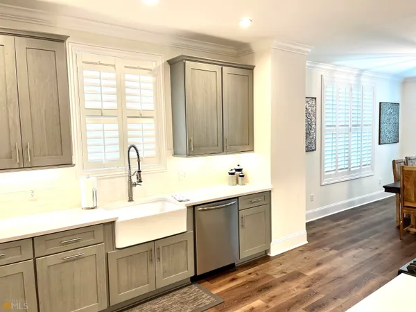 a bathroom with a toilet a sink and shower