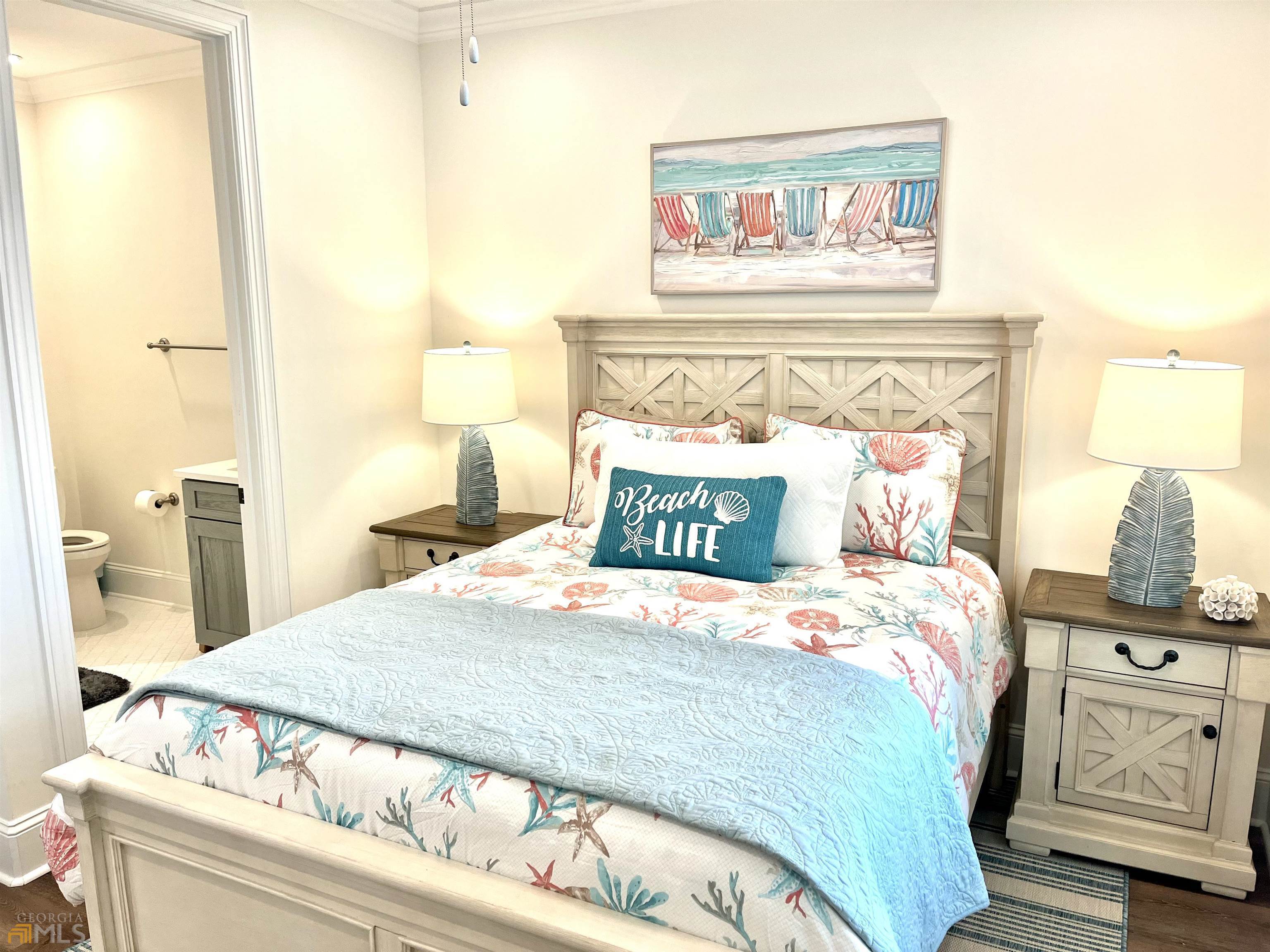 1548 Ocean Boulevard St. Simons, GA 31522 - Photo 30 of 64 a bedroom with a bed and a night stand