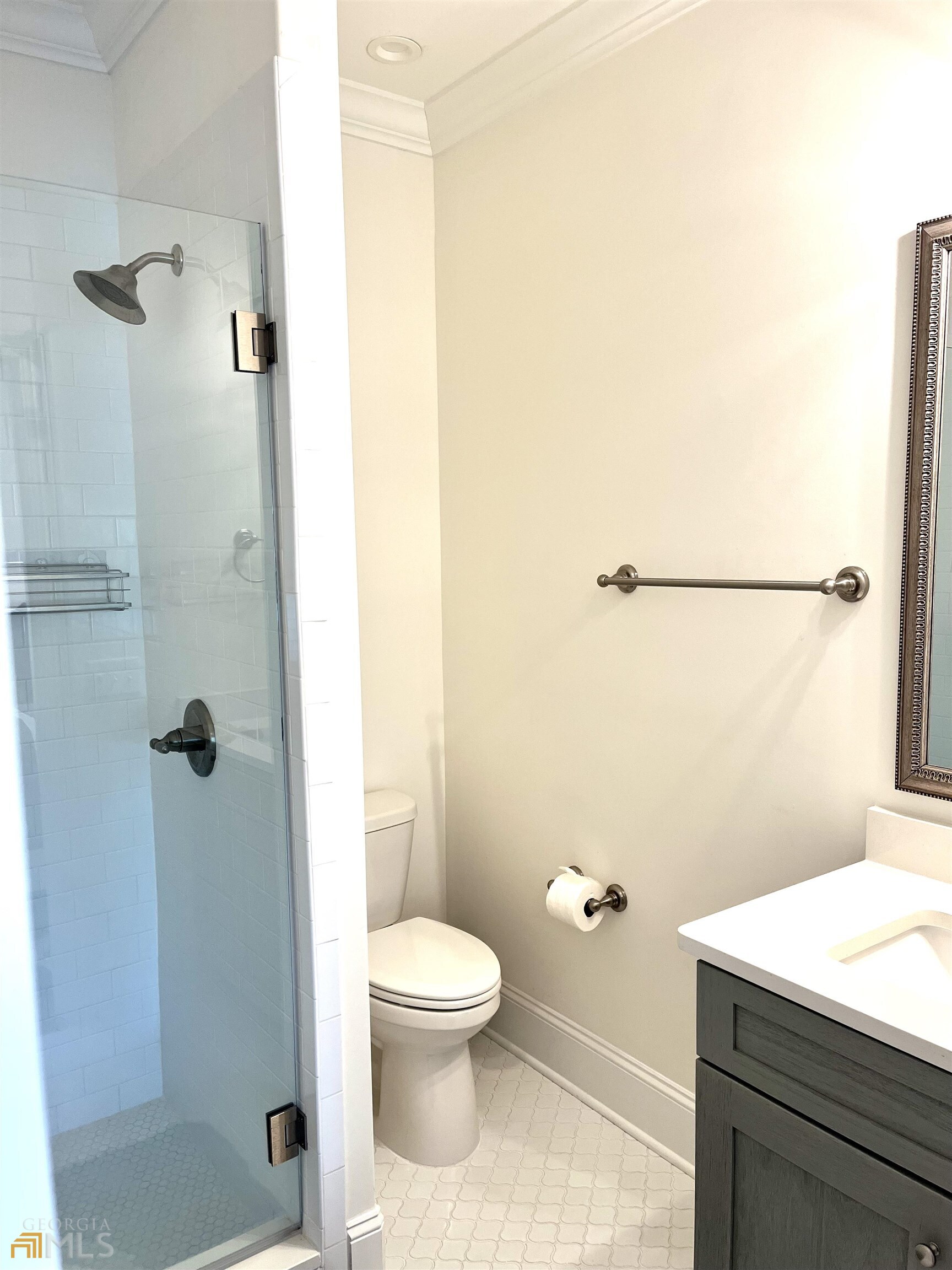 1548 Ocean Boulevard St. Simons, GA 31522 - Photo 31 of 64 a bathroom with a toilet a sink and shower