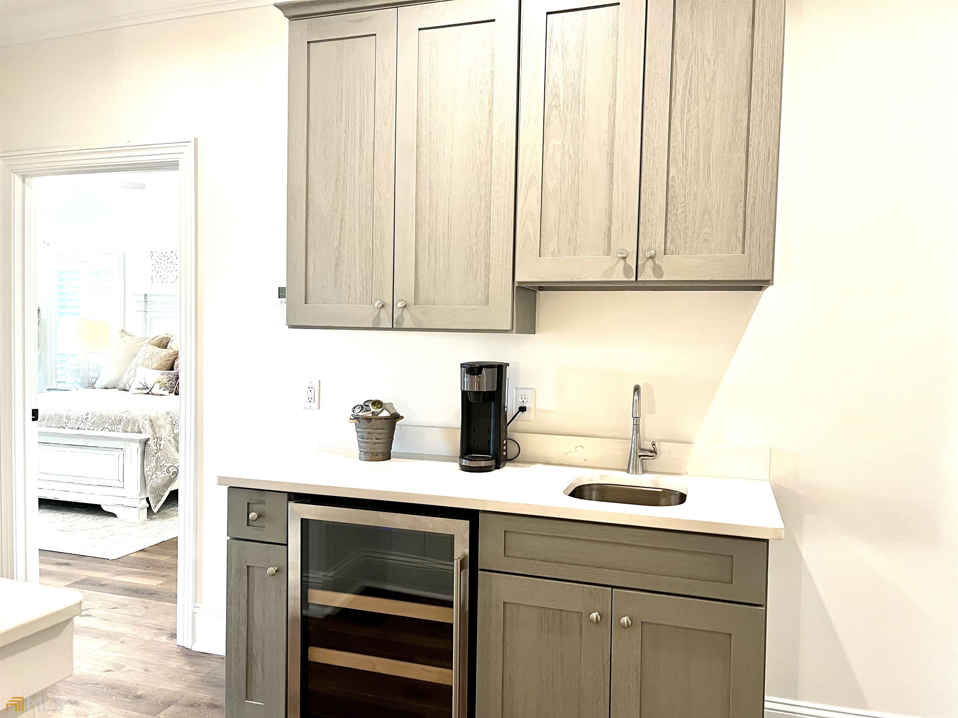1548 Ocean Boulevard St. Simons, GA 31522 - Photo 35 of 64 a kitchen with a sink cabinets and a window