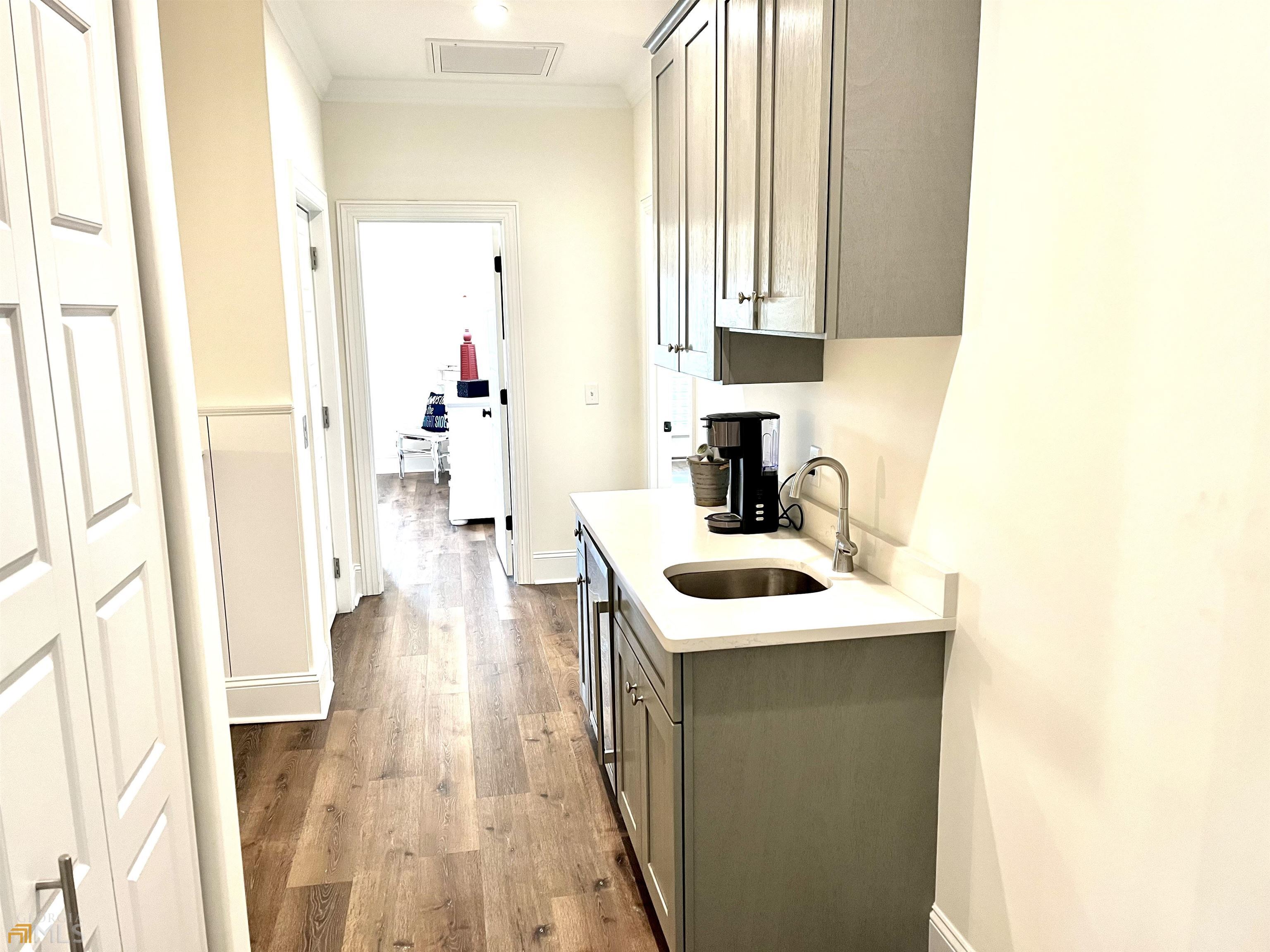 1548 Ocean Boulevard St. Simons, GA 31522 - Photo 36 of 64 a bathroom with a sink and a mirror