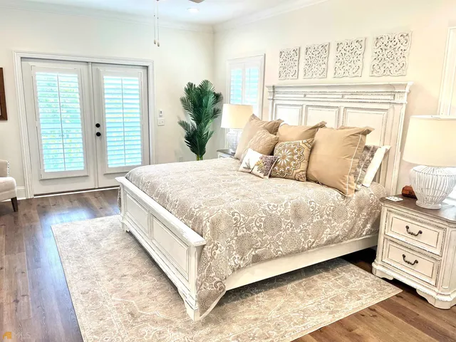 a bathroom with double vanity and a mirror