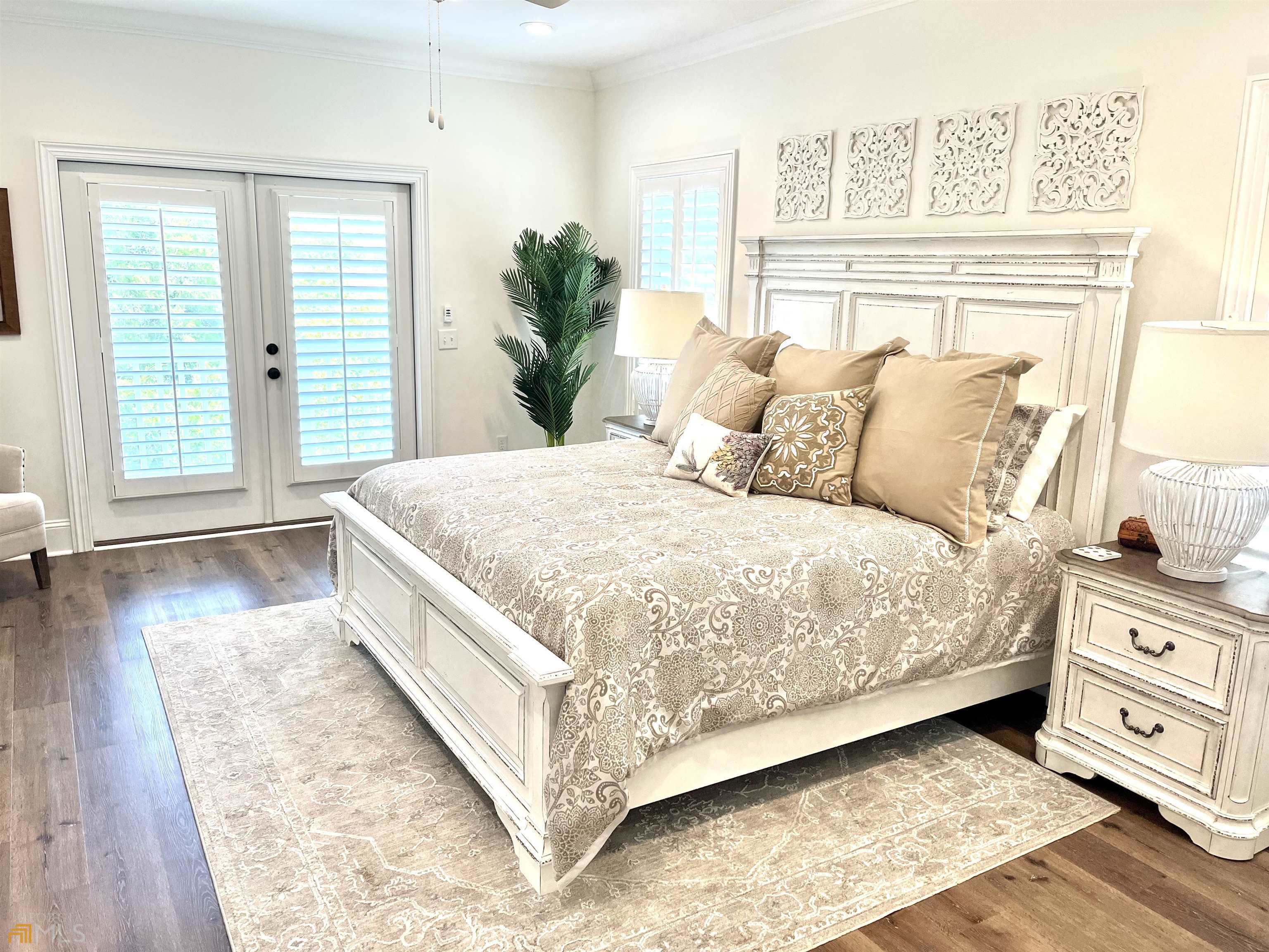 1548 Ocean Boulevard St. Simons, GA 31522 - Photo 37 of 64 a large bedroom with bed and wooden floor