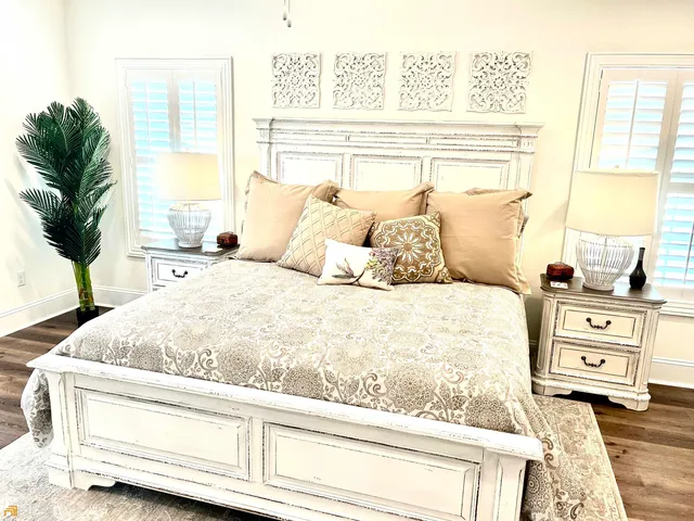 a bedroom with a bed and a dresser