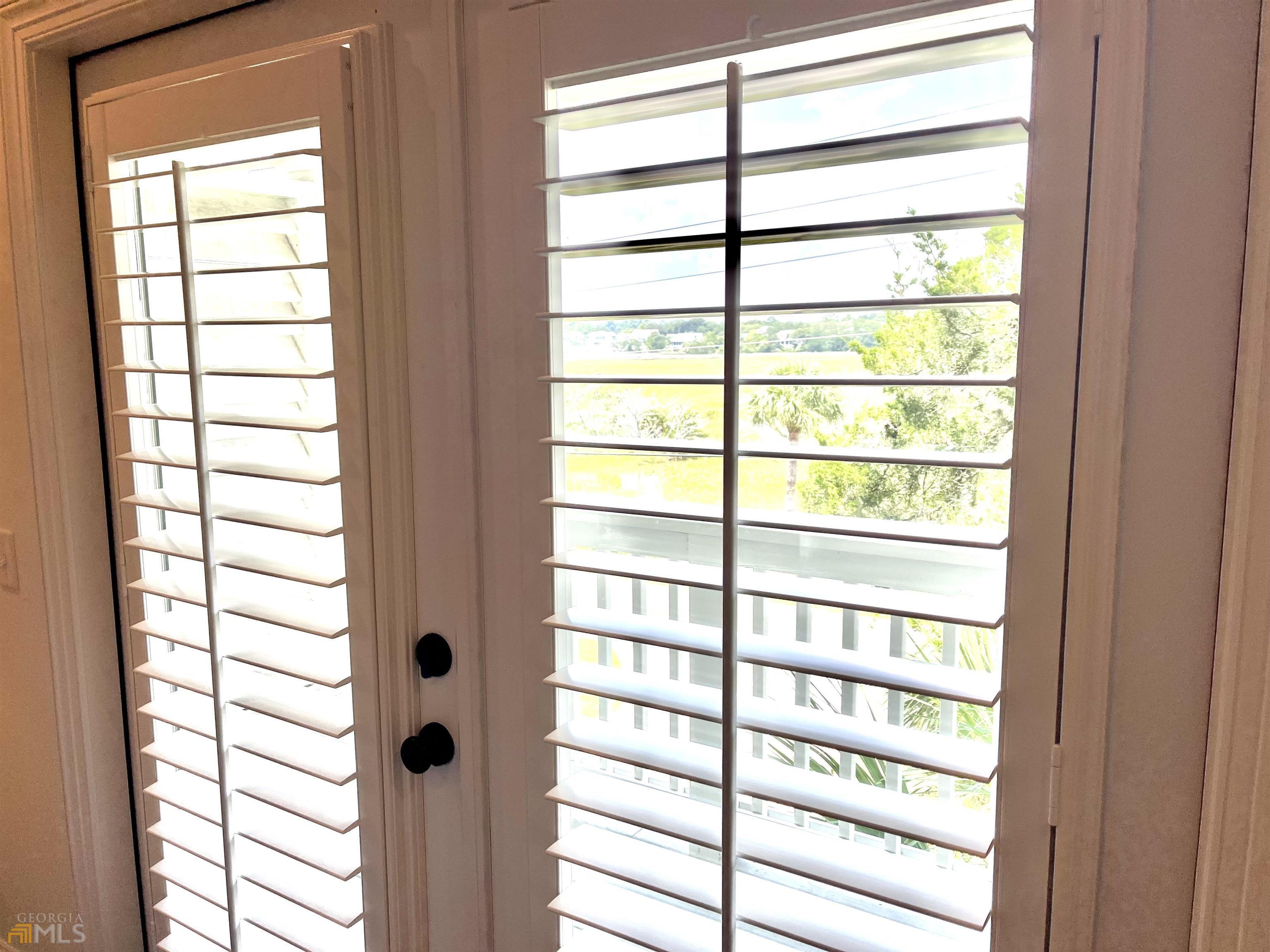 1548 Ocean Boulevard St. Simons, GA 31522 - Photo 41 of 64 a view of a window and a room