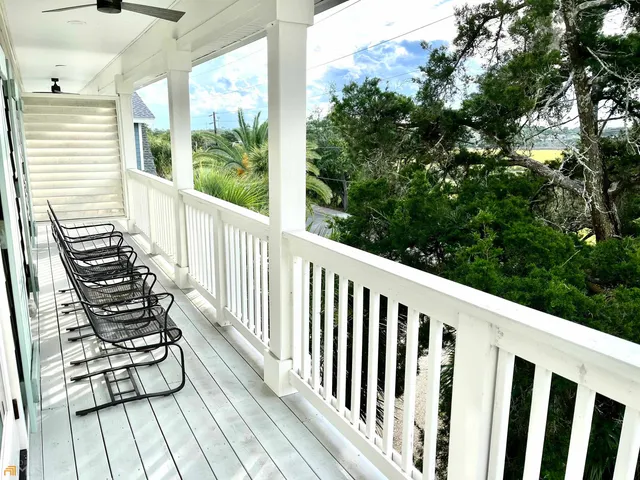 a bedroom with two beds and a window
