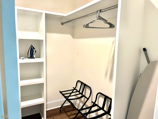 a view of balcony with wooden floor and a window