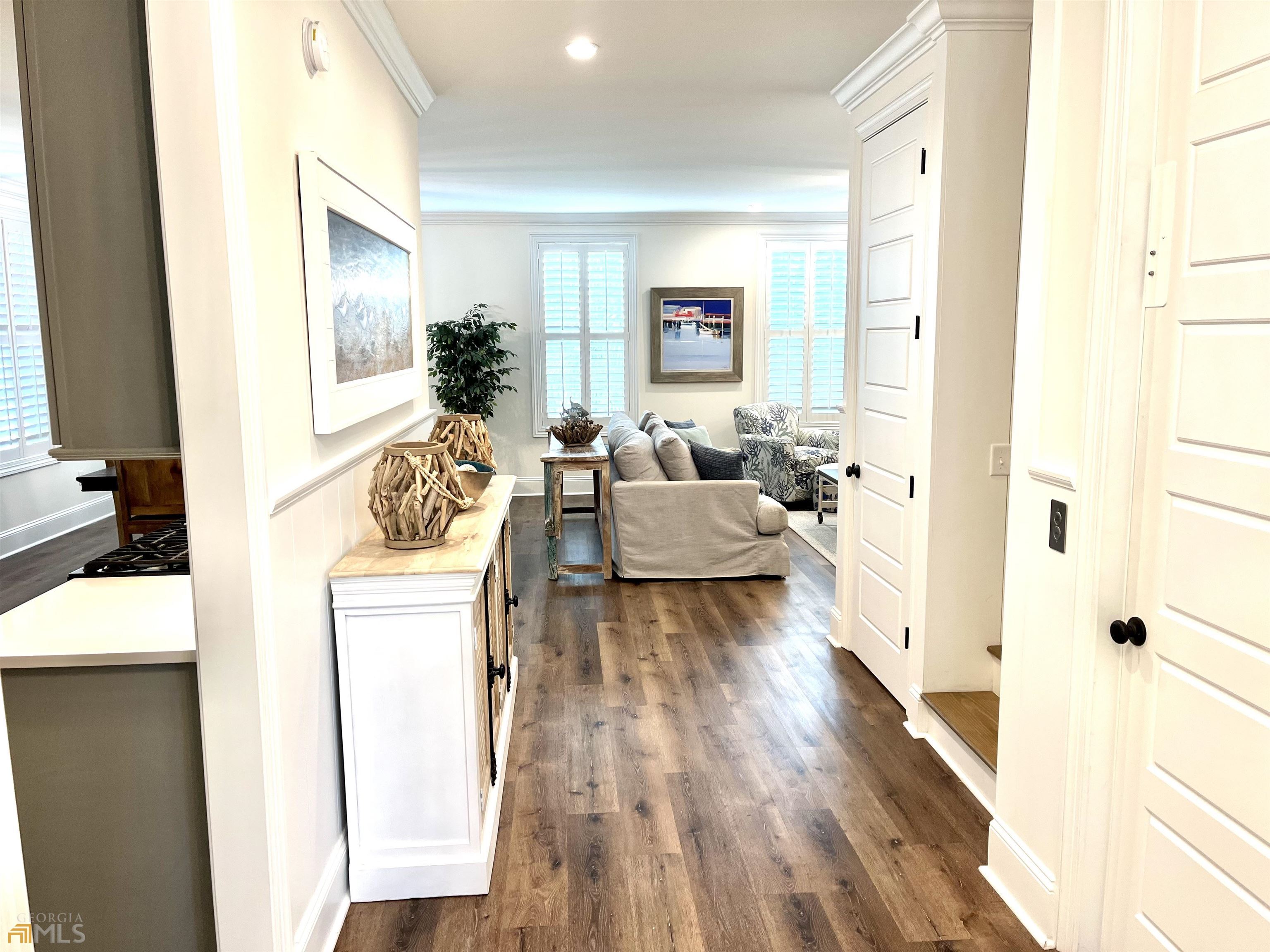 1548 Ocean Boulevard St. Simons, GA 31522 - Photo 5 of 64 a living room with furniture and a large window
