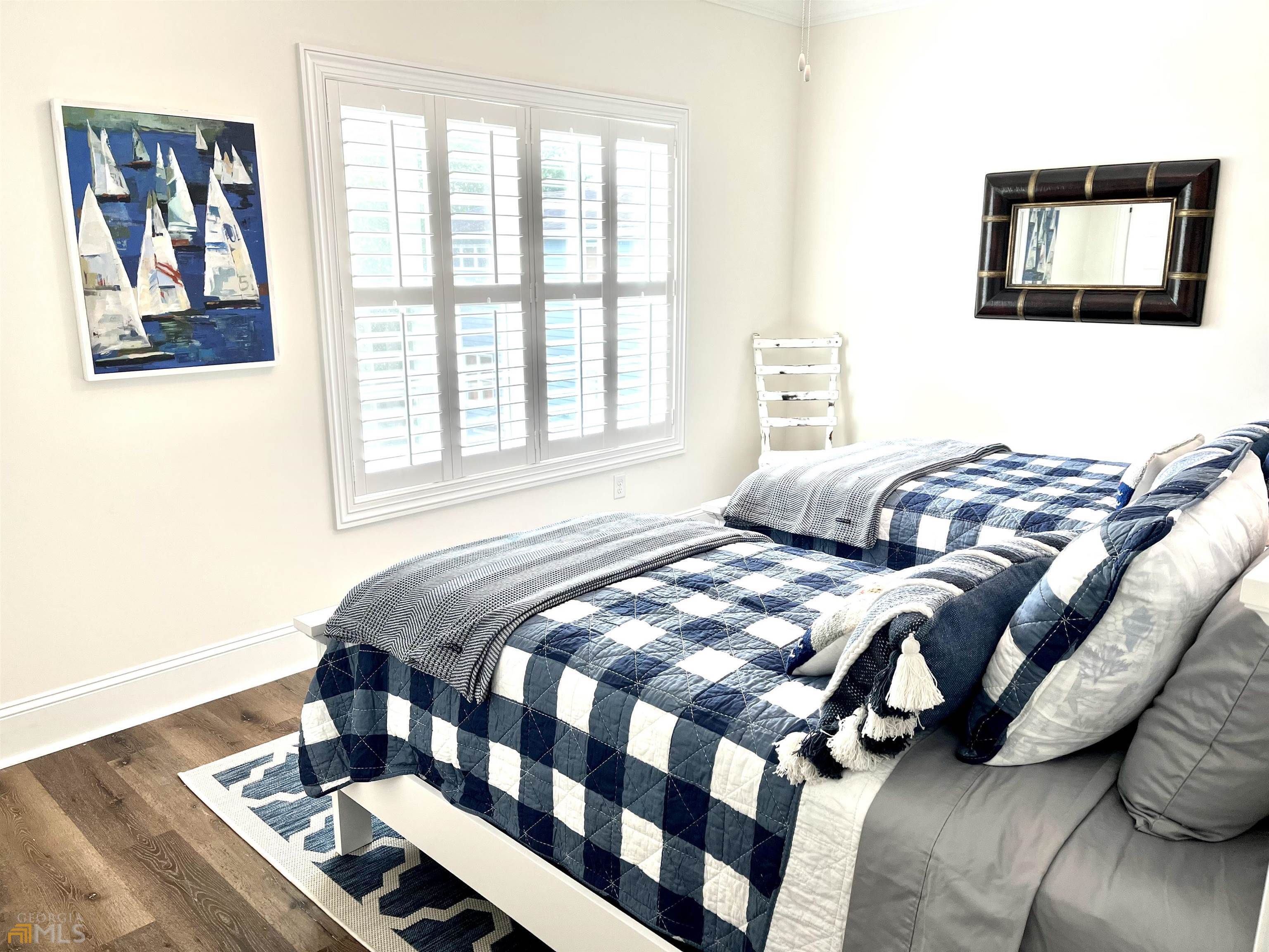 1548 Ocean Boulevard St. Simons, GA 31522 - Photo 52 of 64 a bedroom with two beds and a window