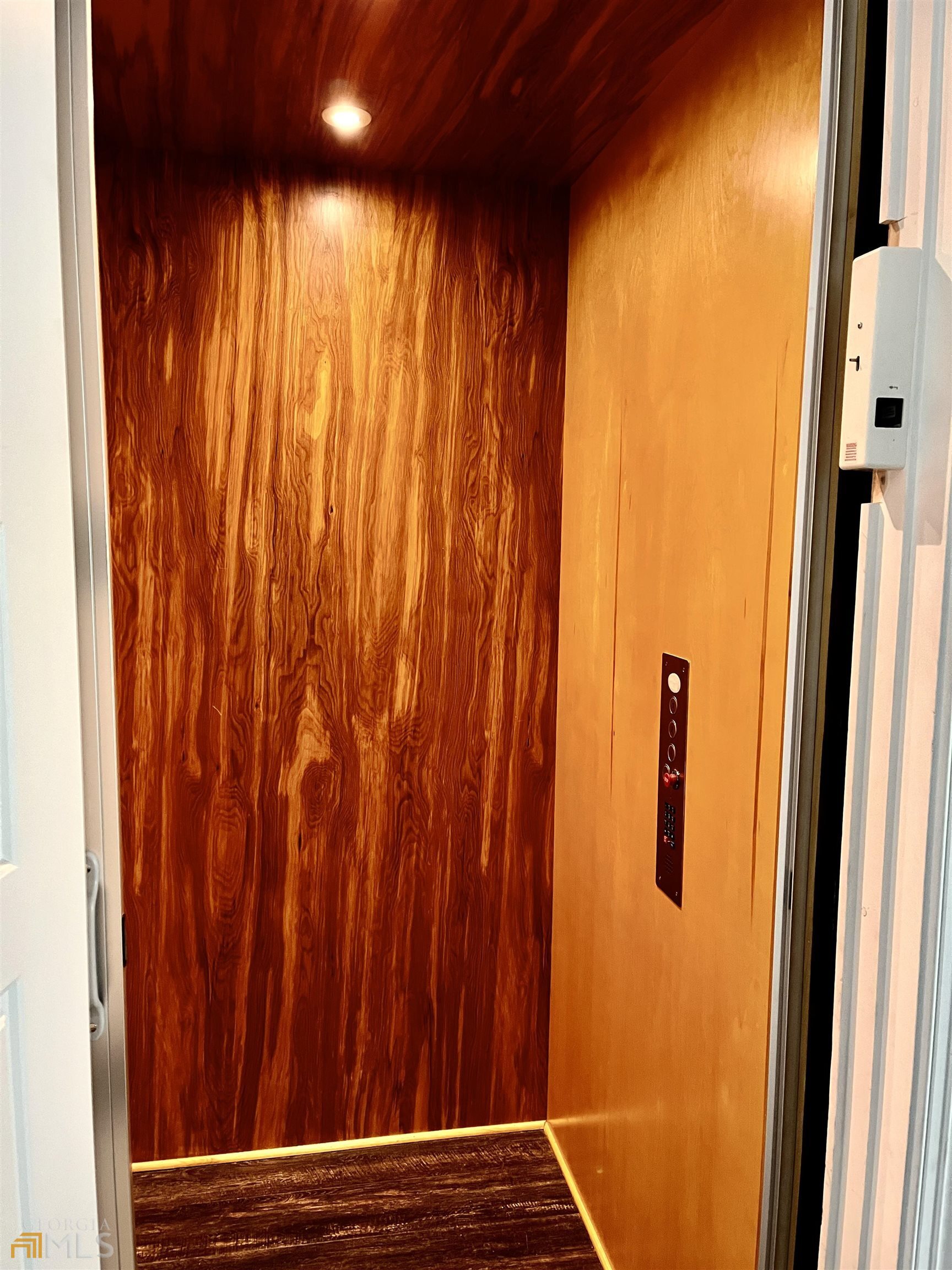 1548 Ocean Boulevard St. Simons, GA 31522 - Photo 56 of 64 a view of balcony with wooden floor and a window