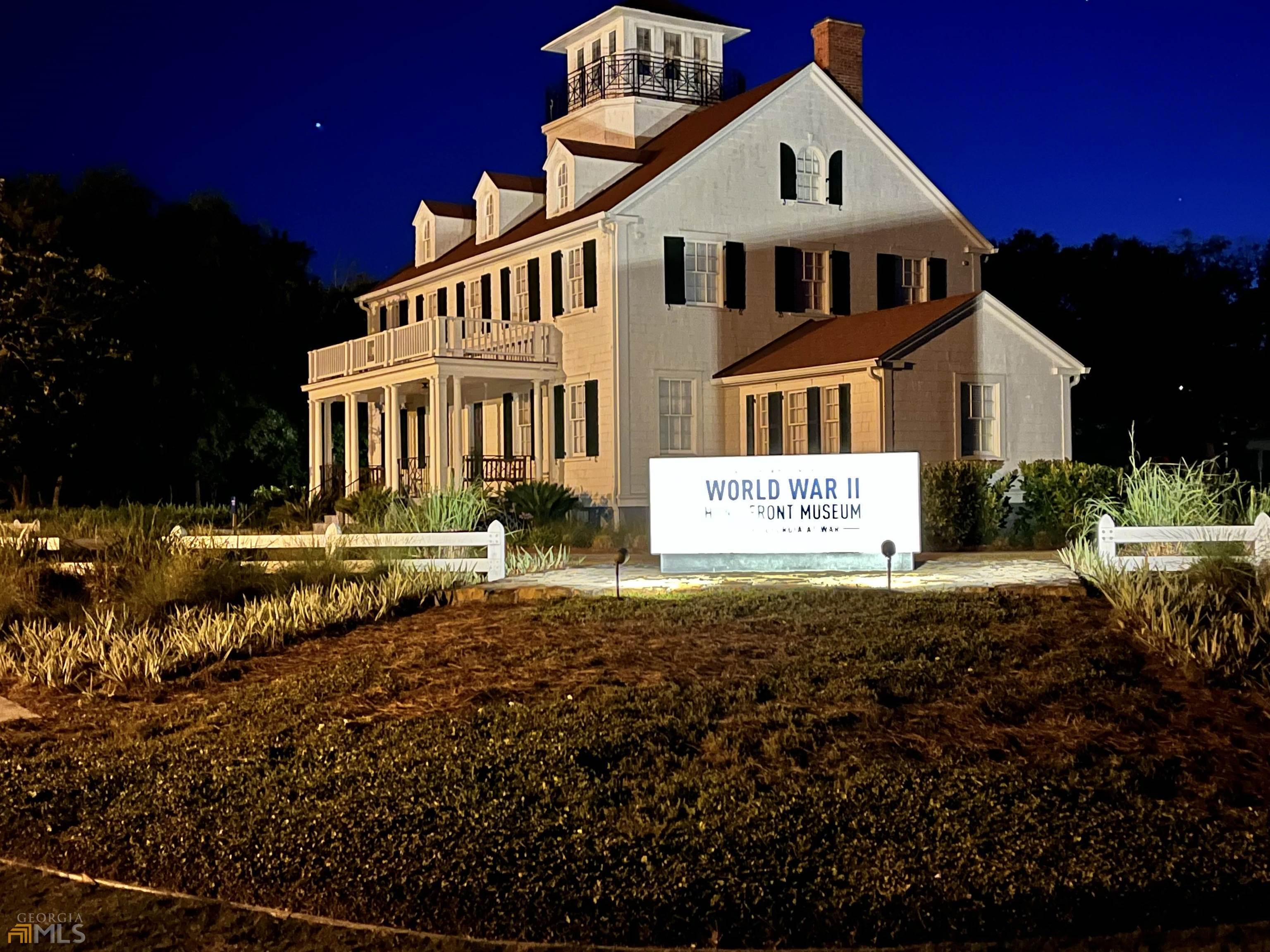 1548 Ocean Boulevard St. Simons, GA 31522 - Photo 61 of 64 a front view of a house with a yard